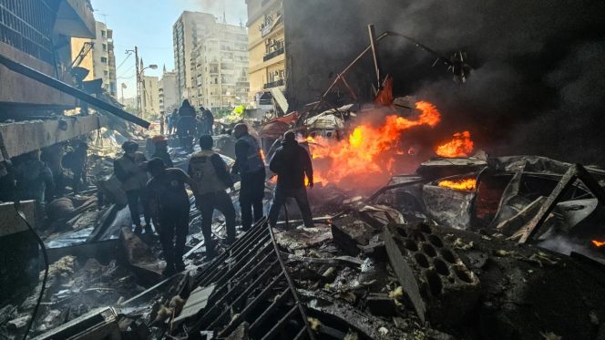 
					First responders stand amid rubble at the site of an Israeli air strike in Beirut's Corniche al-Mazraa neighbourhood on 8 April 2026 (AFP)